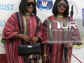 L-R: Taiwo Adeleke and Kehinde Adeleke, female twins, pose for a photograph during the 2024 edition of the annual World Twins Festival in Ig...