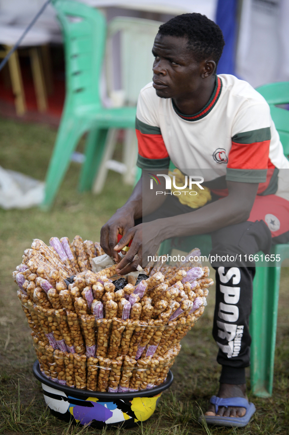 A snacks seller awaits customers during the 2024 edition of the annual World Twins Festival in Igbo-Ora, Nigeria, on October 12, 2024. 