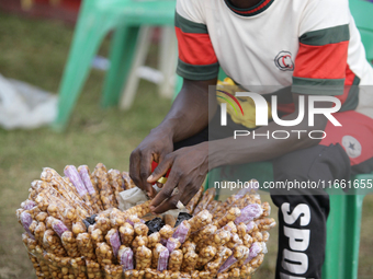 A snacks seller awaits customers during the 2024 edition of the annual World Twins Festival in Igbo-Ora, Nigeria, on October 12, 2024. (