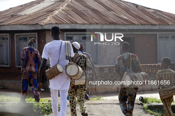 Local entertainers return home after the 2024 edition of the annual World Twins Festival in Igbo-Ora, the Land of Twins, in Oyo State, Niger...