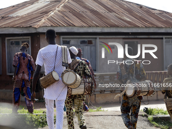 Local entertainers return home after the 2024 edition of the annual World Twins Festival in Igbo-Ora, the Land of Twins, in Oyo State, Niger...