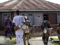 Local entertainers return home after the 2024 edition of the annual World Twins Festival in Igbo-Ora, the Land of Twins, in Oyo State, Niger...