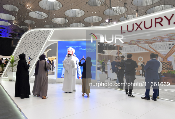 Visitors attend the Cityscape Qatar 2024 real estate exhibition at the Doha Exhibition and Convention Center in Doha, Qatar, on October 13,...