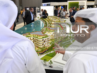 Visitors attend the Cityscape Qatar 2024 real estate exhibition at the Doha Exhibition and Convention Center in Doha, Qatar, on October 13,...