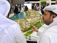 Visitors attend the Cityscape Qatar 2024 real estate exhibition at the Doha Exhibition and Convention Center in Doha, Qatar, on October 13,...