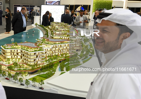 Visitors attend the Cityscape Qatar 2024 real estate exhibition at the Doha Exhibition and Convention Center in Doha, Qatar, on October 13,...