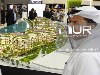 Visitors attend the Cityscape Qatar 2024 real estate exhibition at the Doha Exhibition and Convention Center in Doha, Qatar, on October 13,...