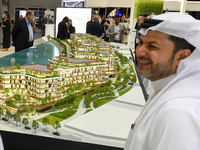 Visitors attend the Cityscape Qatar 2024 real estate exhibition at the Doha Exhibition and Convention Center in Doha, Qatar, on October 13,...