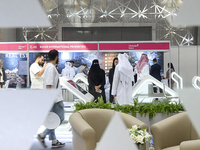 Visitors attend the Cityscape Qatar 2024 real estate exhibition at the Doha Exhibition and Convention Center in Doha, Qatar, on October 13,...