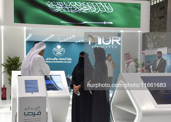 Visitors gather at the Saudi Arabian Real Estate pavilion at the Cityscape Qatar 2024 real estate exhibition at the Doha Exhibition and Conv...