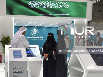 Visitors gather at the Saudi Arabian Real Estate pavilion at the Cityscape Qatar 2024 real estate exhibition at the Doha Exhibition and Conv...