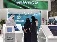 Visitors gather at the Saudi Arabian Real Estate pavilion at the Cityscape Qatar 2024 real estate exhibition at the Doha Exhibition and Conv...