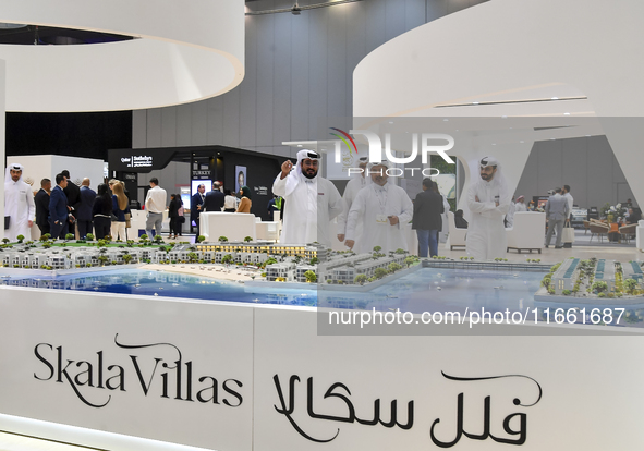 Visitors gather at the Skala Villas Real Estate pavilion at the Cityscape Qatar 2024 real estate exhibition at the Doha Exhibition and Conve...