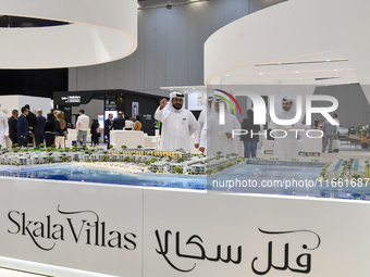 Visitors gather at the Skala Villas Real Estate pavilion at the Cityscape Qatar 2024 real estate exhibition at the Doha Exhibition and Conve...