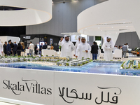 Visitors gather at the Skala Villas Real Estate pavilion at the Cityscape Qatar 2024 real estate exhibition at the Doha Exhibition and Conve...