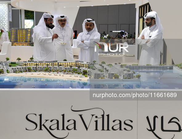 Visitors gather at the Skala Villas Real Estate pavilion at the Cityscape Qatar 2024 real estate exhibition at the Doha Exhibition and Conve...