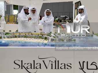 Visitors gather at the Skala Villas Real Estate pavilion at the Cityscape Qatar 2024 real estate exhibition at the Doha Exhibition and Conve...