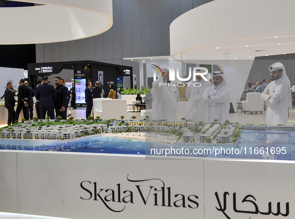 Visitors gather at the Skala Villas Real Estate pavilion at the Cityscape Qatar 2024 real estate exhibition at the Doha Exhibition and Conve...