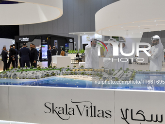 Visitors gather at the Skala Villas Real Estate pavilion at the Cityscape Qatar 2024 real estate exhibition at the Doha Exhibition and Conve...