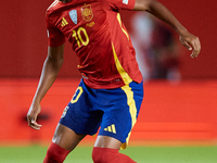 Lamine Yamal of Spain is in action during the UEFA Nations League 2024/25 League A Group A4 game between Spain and Denmark at Enrique Roca S...