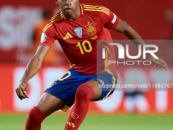 Lamine Yamal of Spain is in action during the UEFA Nations League 2024/25 League A Group A4 game between Spain and Denmark at Enrique Roca S...