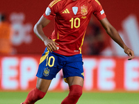 Lamine Yamal of Spain is in action during the UEFA Nations League 2024/25 League A Group A4 game between Spain and Denmark at Enrique Roca S...