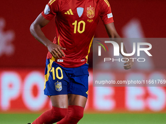 Lamine Yamal of Spain is in action during the UEFA Nations League 2024/25 League A Group A4 game between Spain and Denmark at Enrique Roca S...