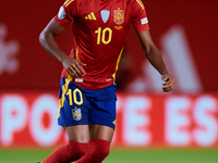 Lamine Yamal of Spain is in action during the UEFA Nations League 2024/25 League A Group A4 game between Spain and Denmark at Enrique Roca S...