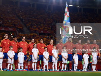 Spain players line up during the national anthems before the UEFA Nations League 2024/25 League A Group A4 game between Spain and Denmark at...