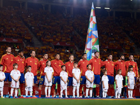 Spain players line up during the national anthems before the UEFA Nations League 2024/25 League A Group A4 game between Spain and Denmark at...