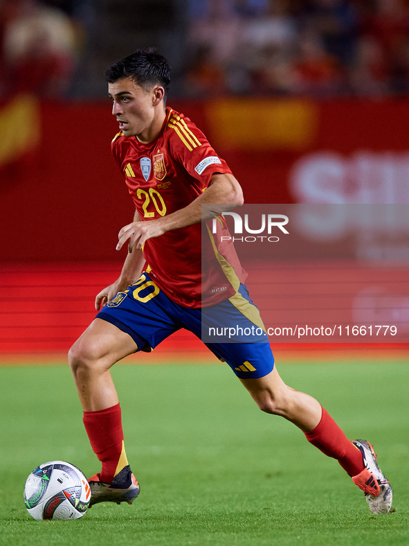 Pedri of Spain is in action during the UEFA Nations League 2024/25 League A Group A4 game between Spain and Denmark at Enrique Roca Stadium...