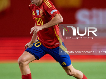 Pedri of Spain is in action during the UEFA Nations League 2024/25 League A Group A4 game between Spain and Denmark at Enrique Roca Stadium...