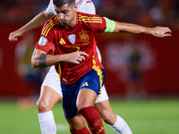 Alvaro Morata of Spain (R) competes for the ball with Hjulmand of Denmark during the UEFA Nations League 2024/25 League A Group A4 game betw...