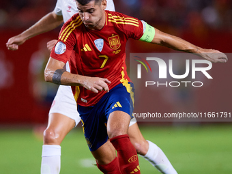 Alvaro Morata of Spain (R) competes for the ball with Hjulmand of Denmark during the UEFA Nations League 2024/25 League A Group A4 game betw...