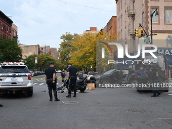 Two people die while riding a motorcycle and crashing into another vehicle in Manhattan, New York, United States, on October 13, 2024. On Su...