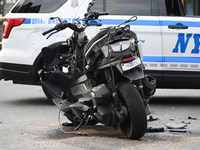 Two people die while riding a motorcycle and crashing into another vehicle in Manhattan, New York, United States, on October 13, 2024. On Su...