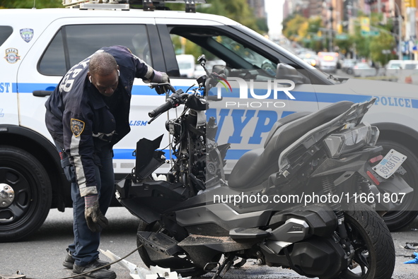 Two people die while riding a motorcycle and crashing into another vehicle in Manhattan, New York, United States, on October 13, 2024. On Su...