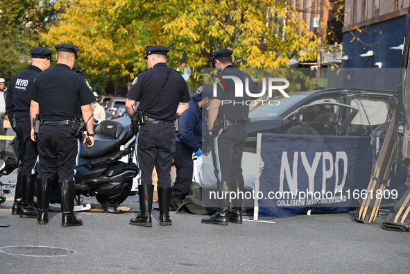 Two people die while riding a motorcycle and crashing into another vehicle in Manhattan, New York, United States, on October 13, 2024. On Su...