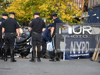 Two people die while riding a motorcycle and crashing into another vehicle in Manhattan, New York, United States, on October 13, 2024. On Su...