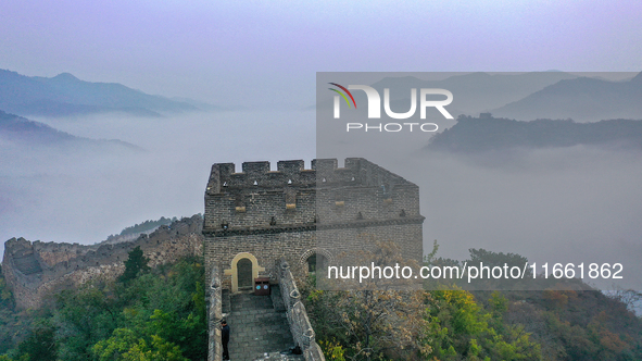 A misty morning mist hangs over the Jinshanling Great Wall in Chengde, China, on October 13, 2024. 