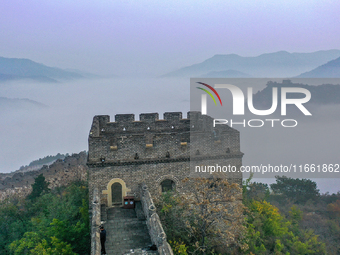 A misty morning mist hangs over the Jinshanling Great Wall in Chengde, China, on October 13, 2024. (