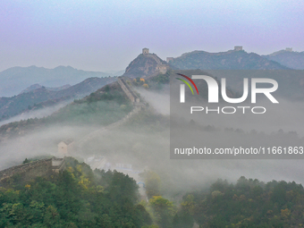 A misty morning mist hangs over the Jinshanling Great Wall in Chengde, China, on October 13, 2024. (