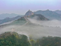 A misty morning mist hangs over the Jinshanling Great Wall in Chengde, China, on October 13, 2024. (