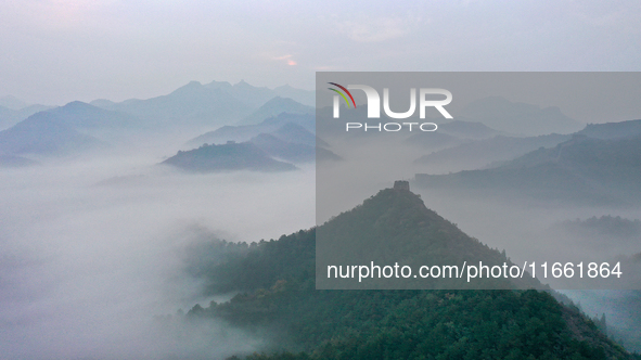 A misty morning mist hangs over the Jinshanling Great Wall in Chengde, China, on October 13, 2024. 