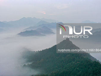 A misty morning mist hangs over the Jinshanling Great Wall in Chengde, China, on October 13, 2024. (