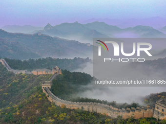 A misty morning mist hangs over the Jinshanling Great Wall in Chengde, China, on October 13, 2024. (