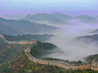 A misty morning mist hangs over the Jinshanling Great Wall in Chengde, China, on October 13, 2024. (