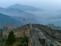 A misty morning mist hangs over the Jinshanling Great Wall in Chengde, China, on October 13, 2024. (