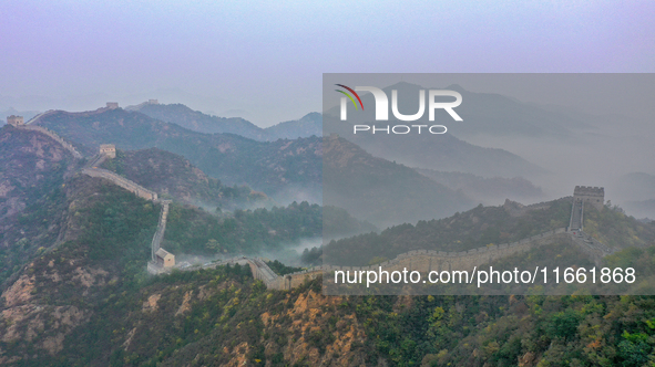 A misty morning mist hangs over the Jinshanling Great Wall in Chengde, China, on October 13, 2024. 