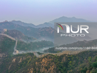 A misty morning mist hangs over the Jinshanling Great Wall in Chengde, China, on October 13, 2024. (